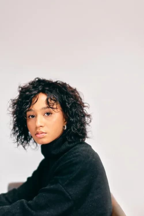 Portrait of a young woman with curly hair
