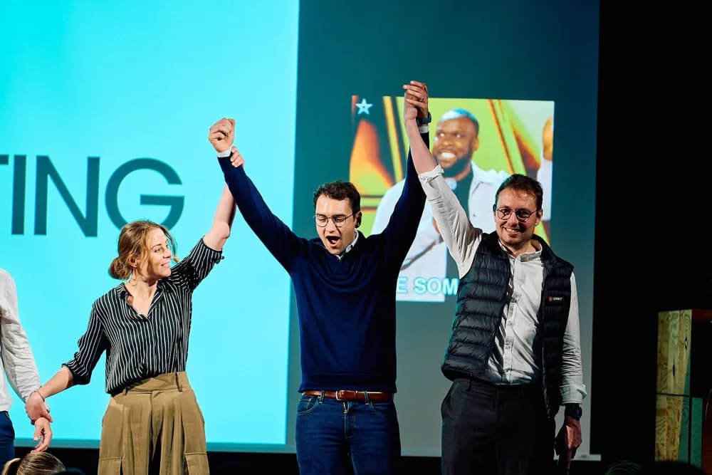 People cheering on stage at a Digital Hub Logistics event